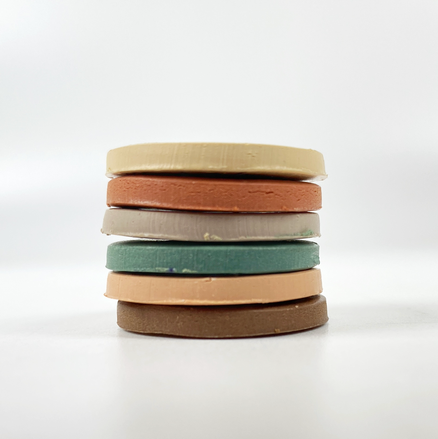 High Desert Palette Polymer Clay Color Mixing Tutorial a stack of sample color clay discs