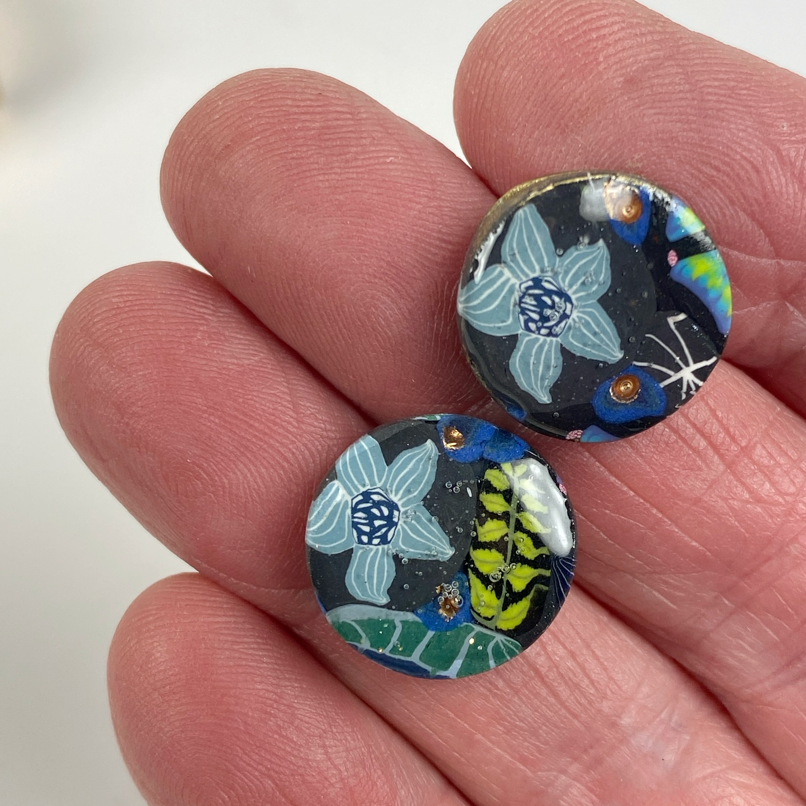 Blue Blossom Handmade Polymer Clay Stud Earrings handheld for size reference