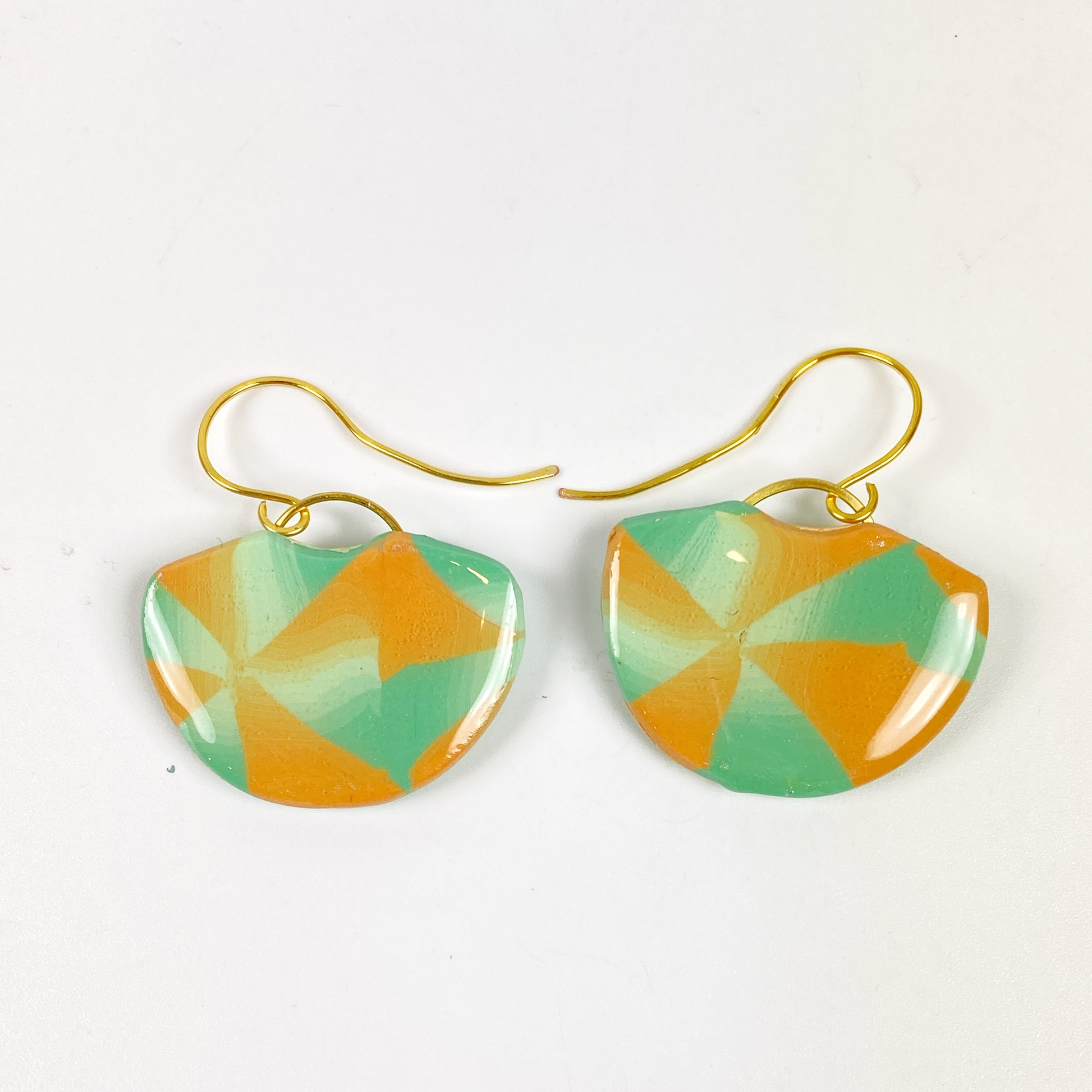 Desert Fan Handmade Polymer Clay Earrings on a neutral background
