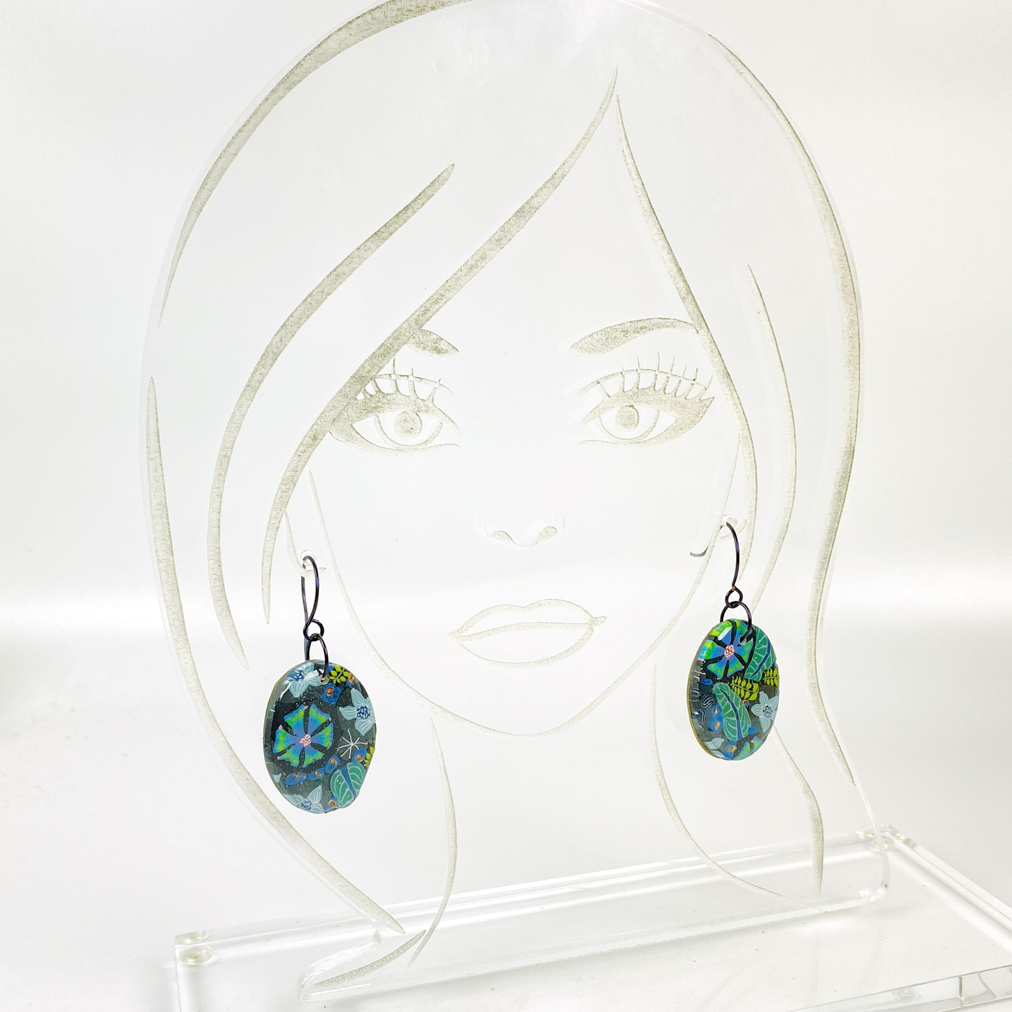 Night Blossom Handmade Polymer Clay Dangle Earrings II on an acrylic display head