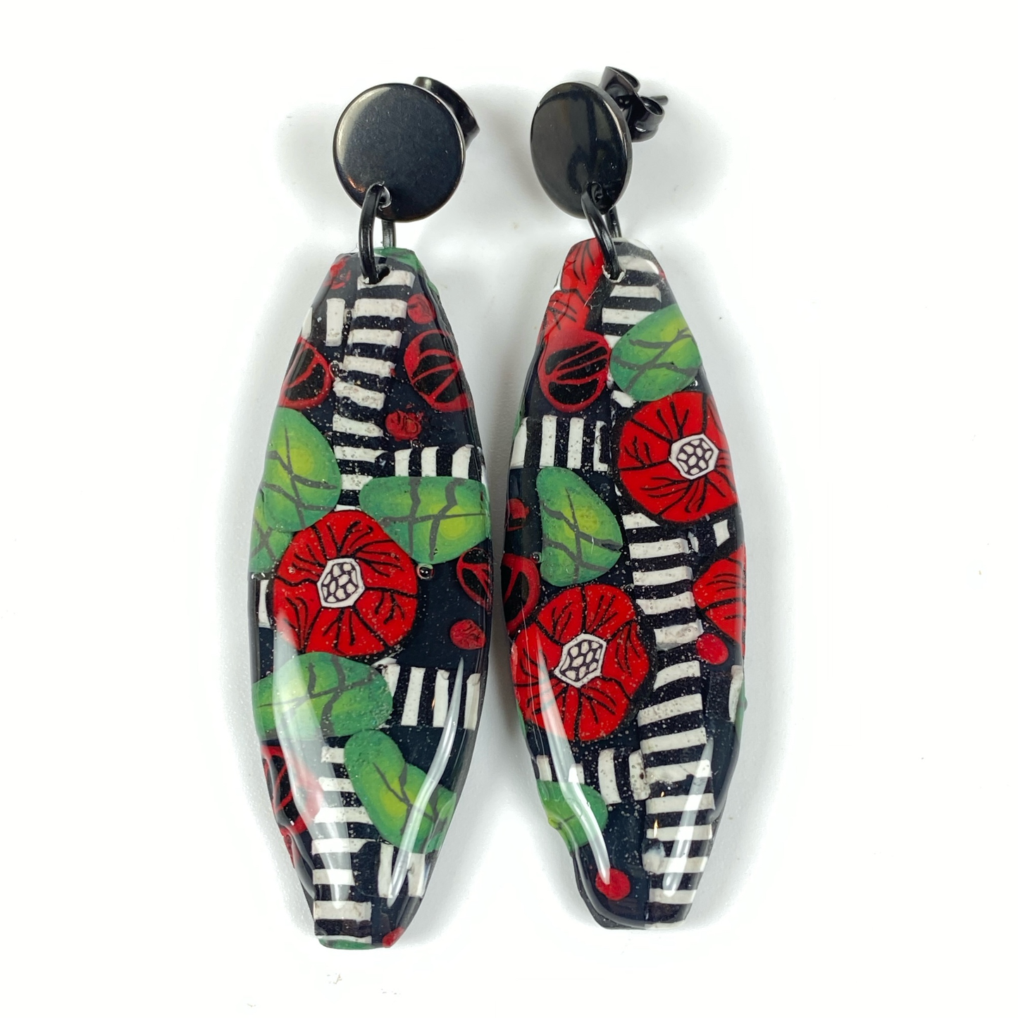 Red Lattice Rose Handmade Polymer Clay Earrings on a white background