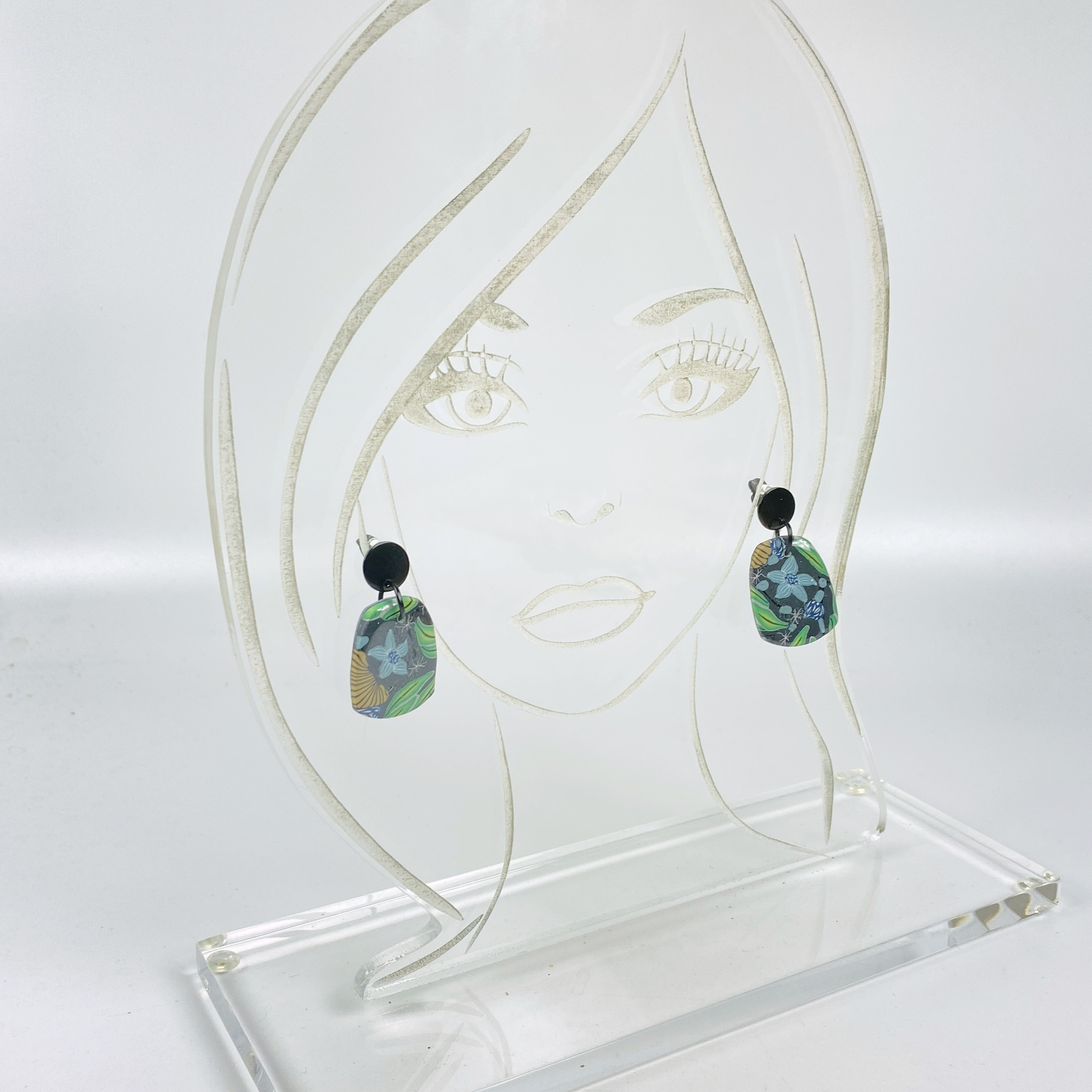 Blue Blossom Handmade Polymer Clay Earrrings on an acrylic display head