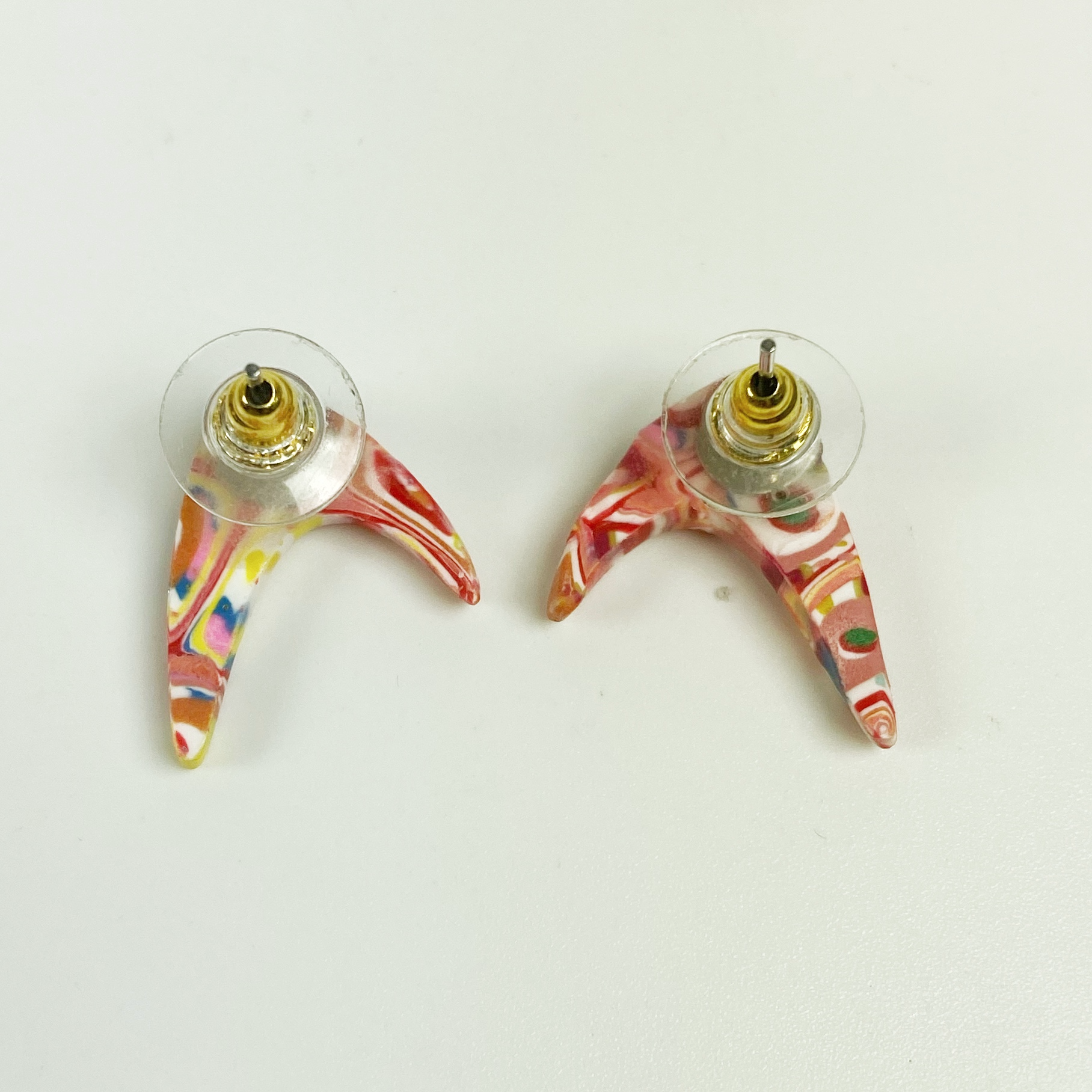 Pink Boomerang Stud Earrings showing the backs
