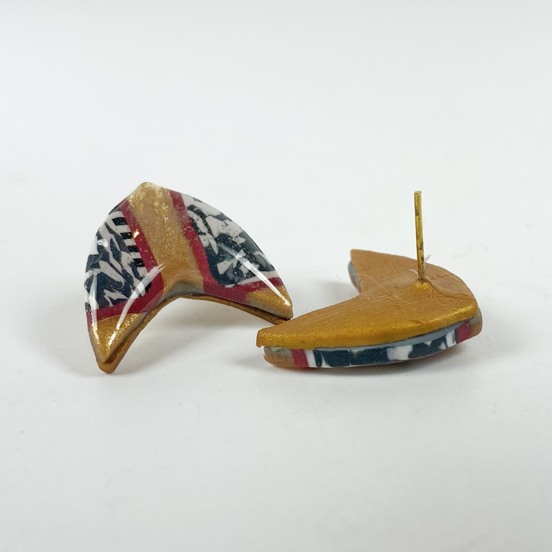 Red and Gold Handmade Polymer Clay Boomerang Stud Earrings, showing the earrings back