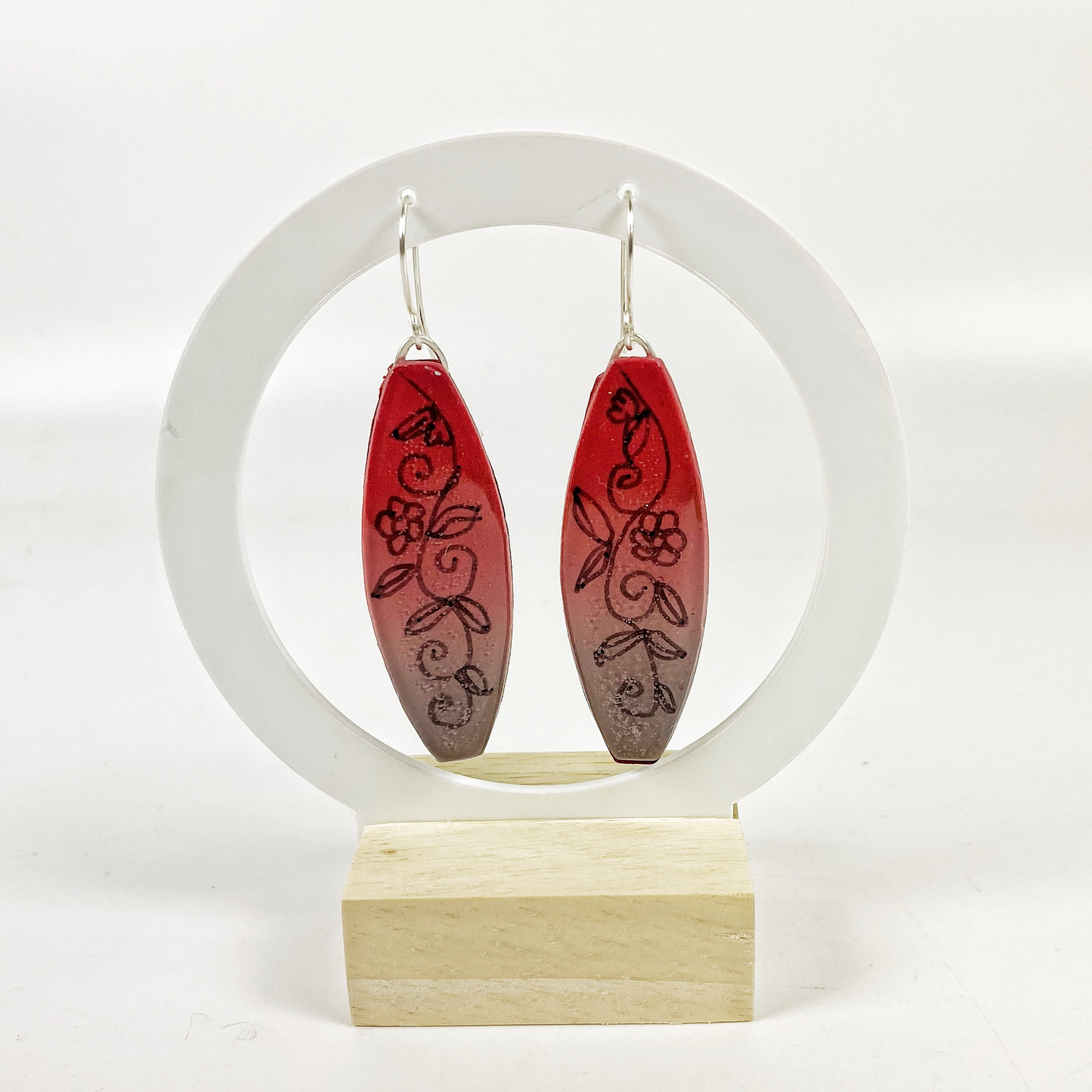 Polymer Clay Twilight Garden Handmade Dangle Earrings on a moon gate earring display stand