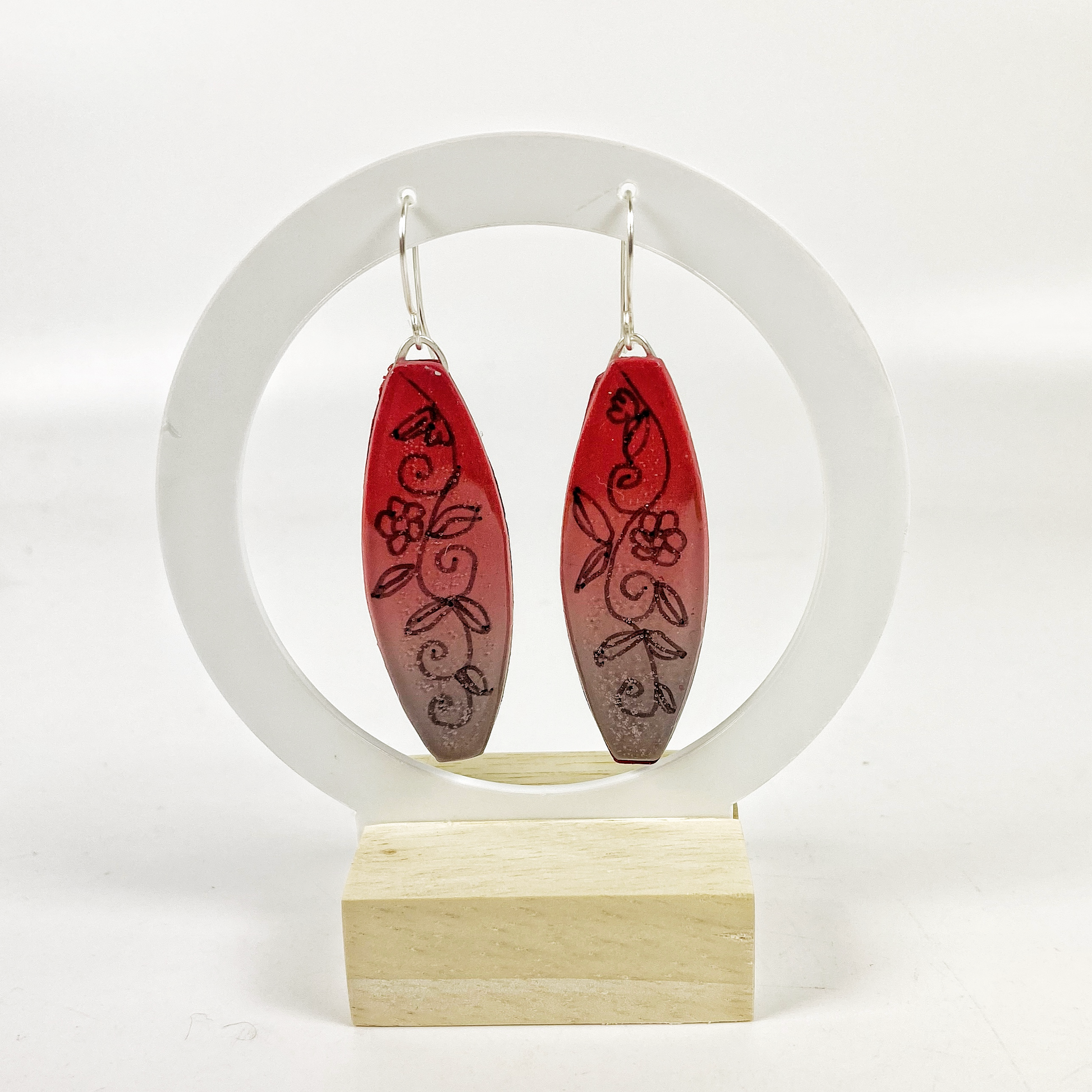 Polymer Clay Twilight Garden Handmade Dangle Earrings on a moon gate earring display stand