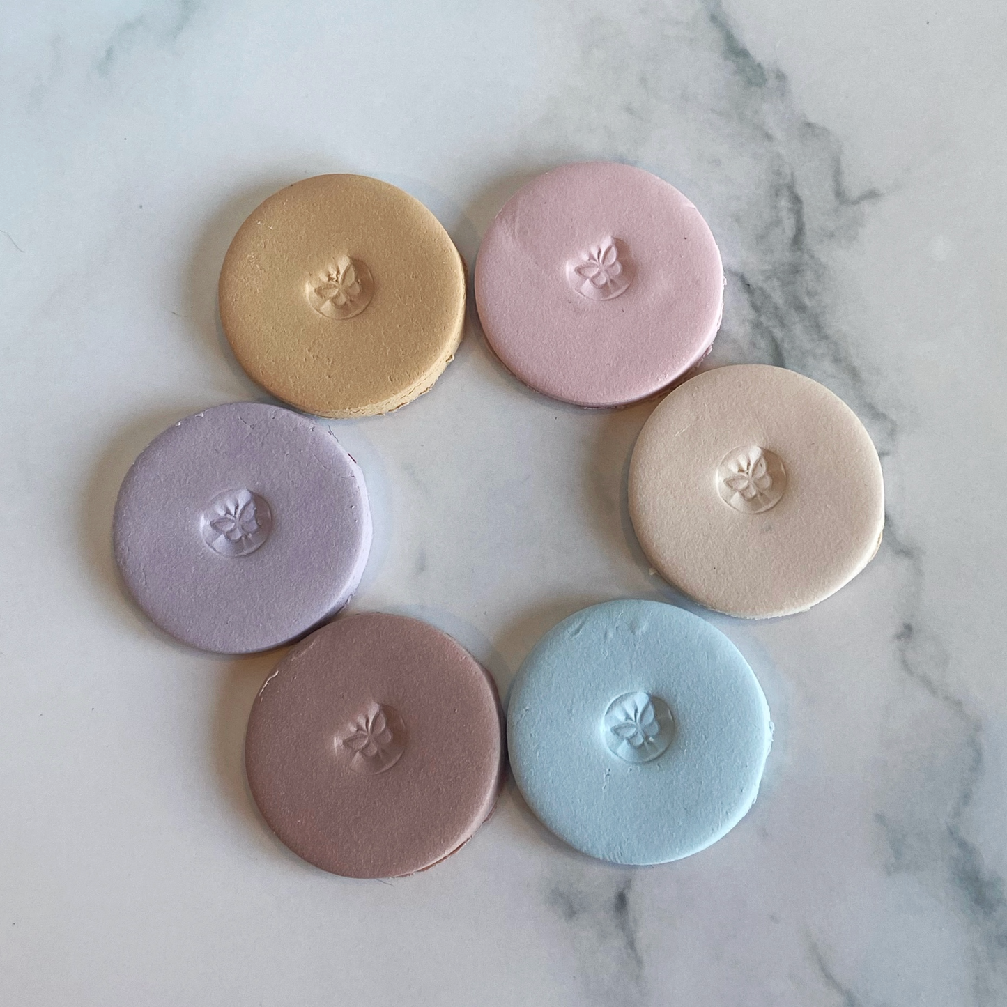 The sample color discs of farmhouse palette laid out in a circle