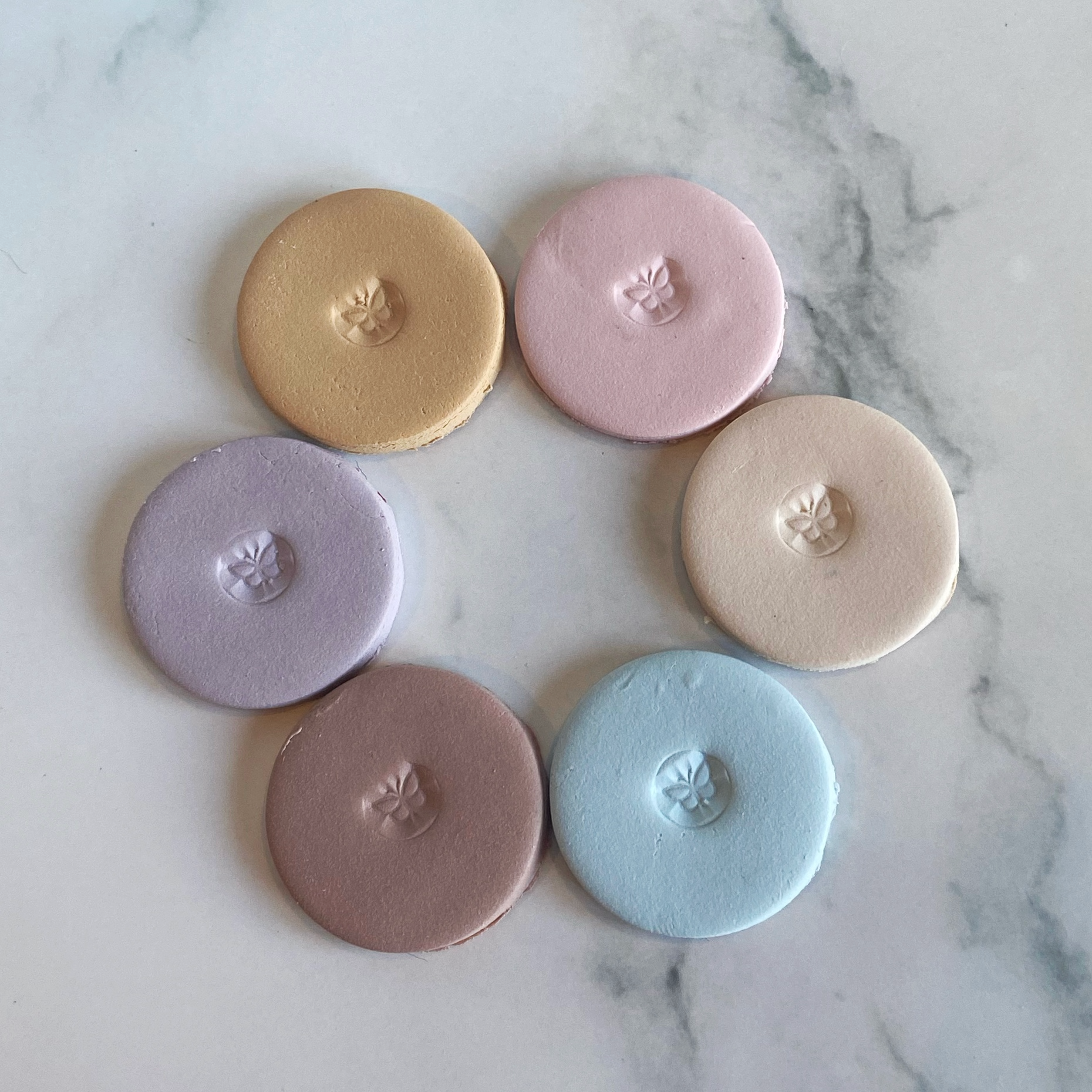 The sample color discs of farmhouse palette laid out in a circle