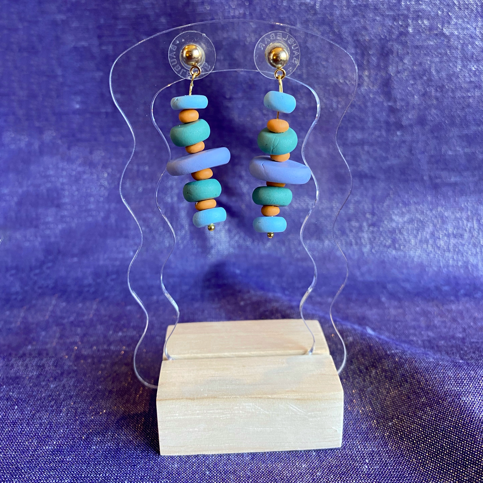 Polymer Clay Cairn Dangle Earrings Handmade on a transparent acrylic stand