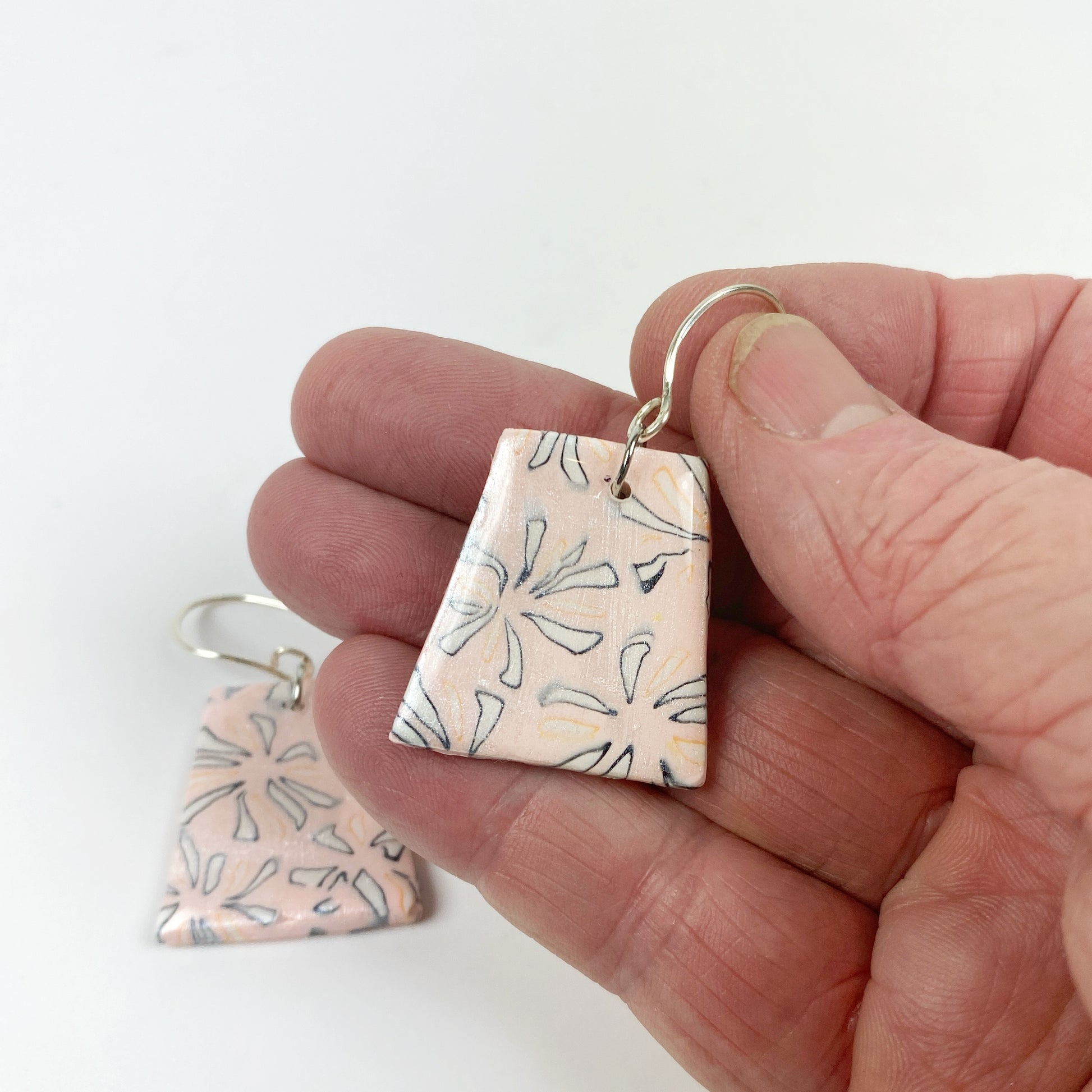 Polymer Clay Handmade Pink Dangle Earrings handheld for size understanding