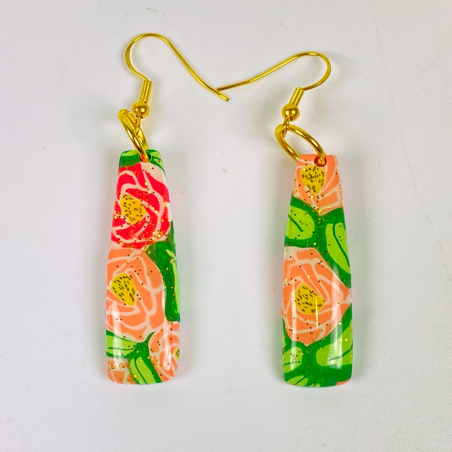 Rose Garden Handmade Polymer Clay Dangle Earrings on a plain background