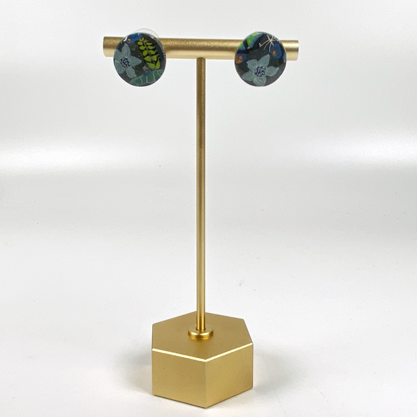 Blue Blossom Handmade Polymer Clay Stud Earrings on a brass earring stand