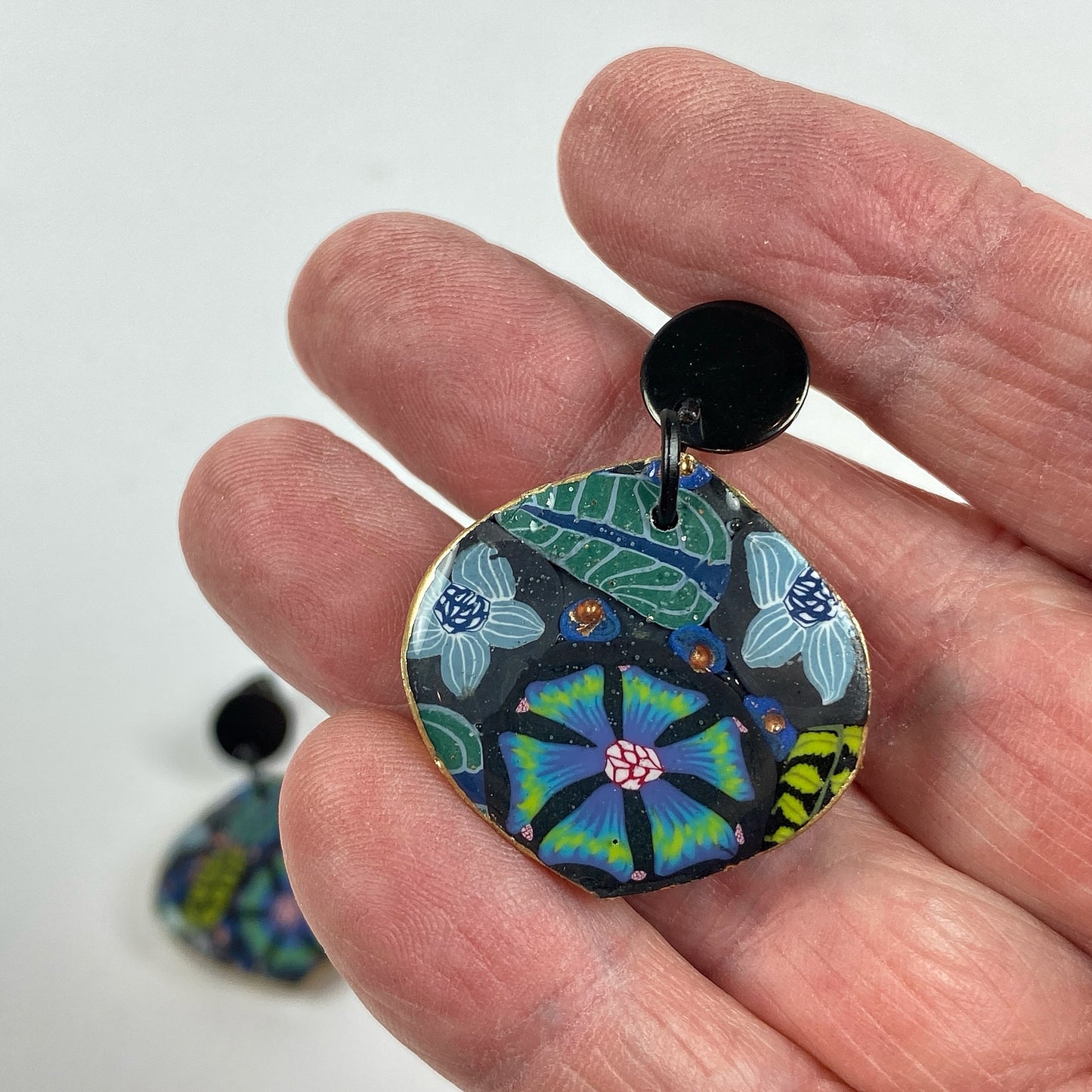 Blue Blossom Handmade Polymer Clay Dangle Earrrings handheld for size reference
