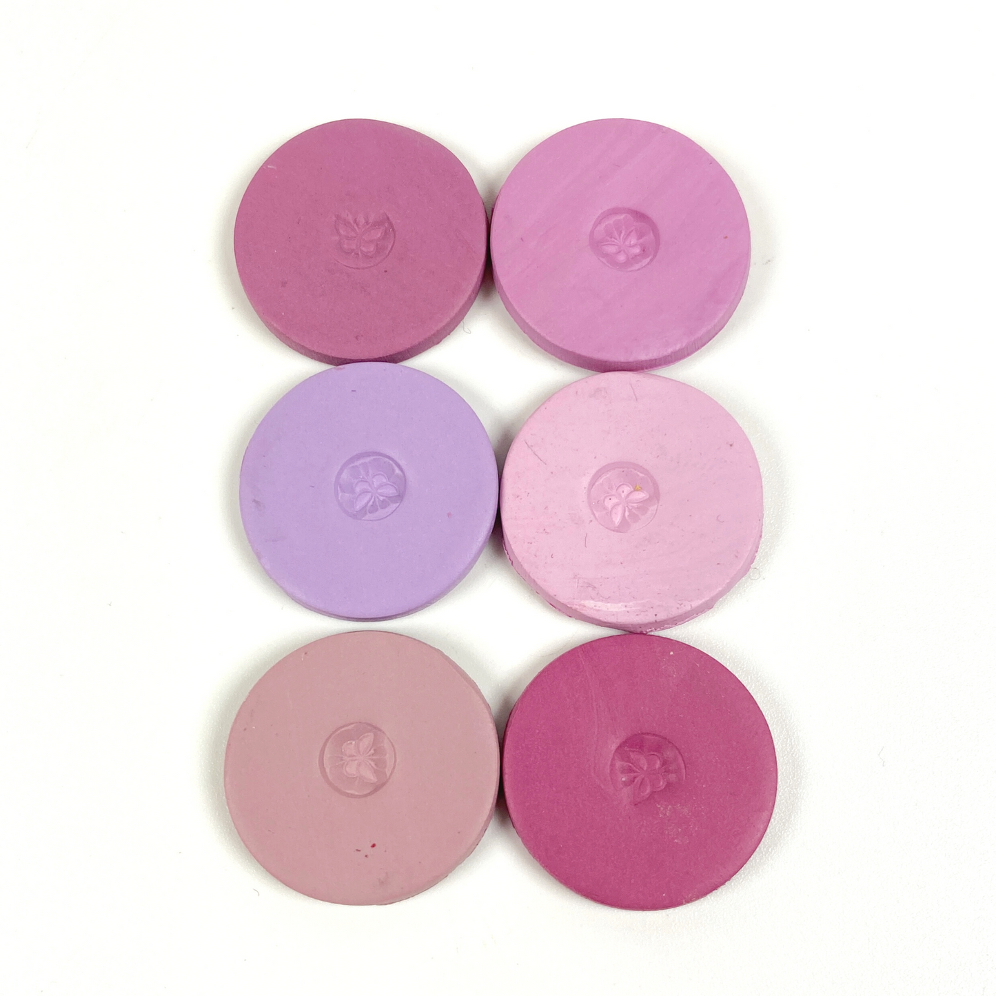 Discs of Polymer Clay in all 6 pink and purple colors of this palette, arranged 2 wide and 3 tall.